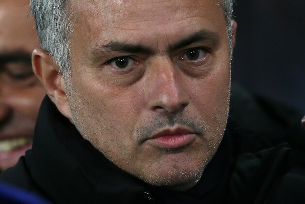 Chelsea Manager José Mourinho looks across the pitch before the Champions League Group G soccer match between Chelsea and Sporting Lisbon at Stamford Bridge in London, Wednesday, Dec. 10, 2014. (AP Photo/Tim Ireland)