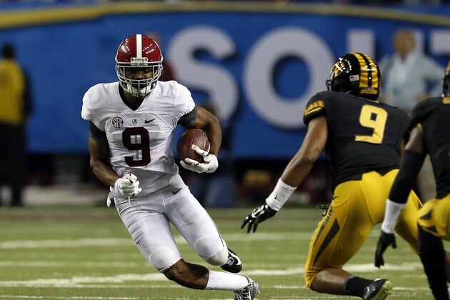 Alabama wide receiver Amari Cooper (9) carries the ball after a reception during the first half of an NCAA college football game against Missouri Saturday, Dec. 6, 2014, in Atlanta, Ga. (AP Photo/Butch Dill)