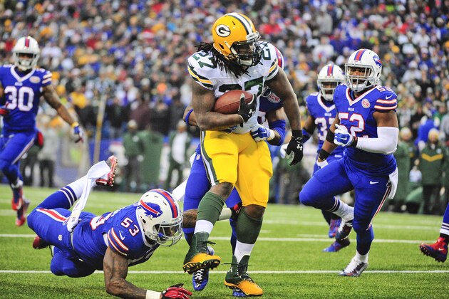Green Bay Packers running back Eddie Lacy (27) rushes past Buffalo Bills' Nigel Bradham (53) during the second half of an NFL football game Sunday, Dec. 14, 2014, in Orchard Park, N.Y. (AP Photo/Gary Wiepert)