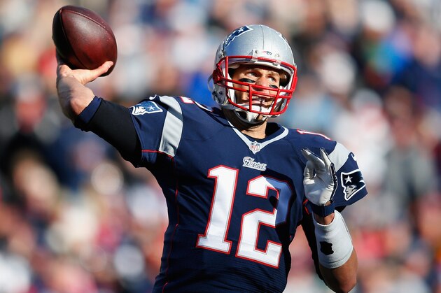 FOXBORO, MA - DECEMBER 14:  Tom Brady #12 of the New England Patriots passes the ball during the first quarter against the Miami Dolphins at Gillette Stadium on December 14, 2014 in Foxboro, Massachusetts.  (Photo by Jim Rogash/Getty Images)