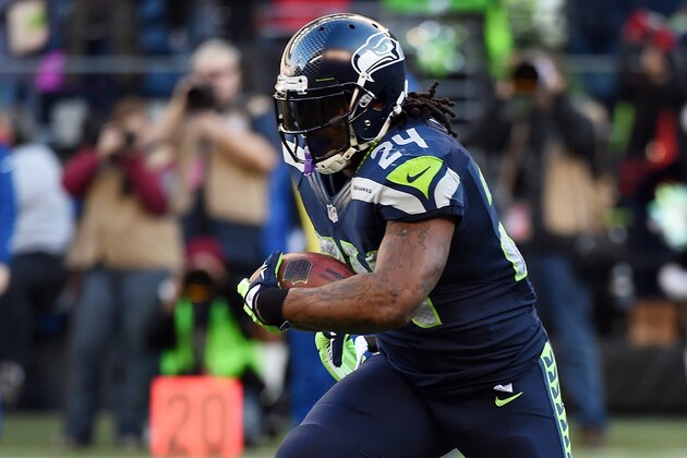 SEATTLE, WA - DECEMBER 14:  Running back Marshawn Lynch #24 of the Seattle Seahawks runs with the ball the first quarter of the game against the San Francisco 49ers at CenturyLink Field on December 14, 2014 in Seattle, Washington.  (Photo by Steve Dykes/Getty Images)