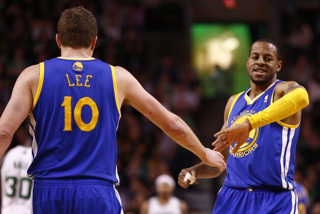 Mar 5, 2014; Boston, MA, USA; Golden State Warriors small forward Andre Iguodala (9) and power forward David Lee (10) celebrate during the second half of a game against the Boston Celtics at TD Garden. Mandatory Credit: Mark L. Baer-USA TODAY Sports