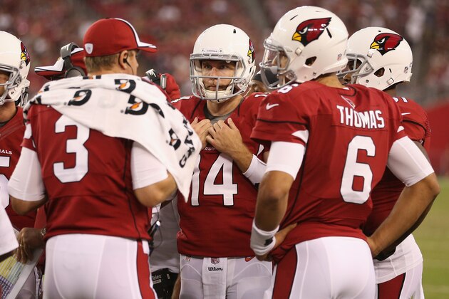 GLENDALE, AZ - AUGUST 09:  (L-R) Quarterbacks Carson Palmer #3, Ryan Lindley #14 and Logan Thomas #6 of the Arizona Cardinals talk on the field during the preseason NFL game against the Houston Texans at the University of Phoenix Stadium on August 9, 2014 in Glendale, Arizona. The Cardinals defeated the Texans 32-0.  (Photo by Christian Petersen/Getty Images)