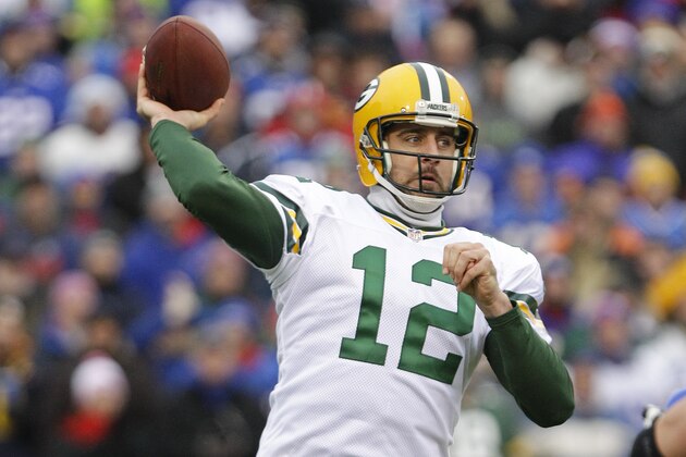 Green Bay Packers quarterback Aaron Rodgers (12) throws a pass during the first half of an NFL football game against the Buffalo Bills Sunday, Dec. 14, 2014, in Orchard Park, N.Y. (AP Photo/Bill Wippert)