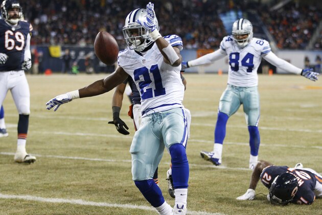 CHICAGO, IL - DECEMBER 4: Joseph Randle #21 of the Dallas Cowboys tosses the ball after scoring a touchdown during the third quarter of a game at Soldier Field on December 4, 2014 in Chicago, Illinois. (Photo by Joe Robbins/Getty Images)