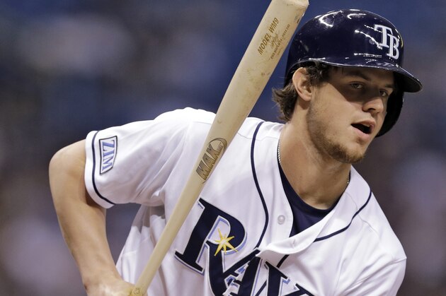 Tampa Bay Rays' Wil Myers draws a walk off New York Yankees starting pitcher Chris Capuano during the first inning of a baseball game Monday, Sept. 15, 2014, in St. Petersburg, Fla. (AP Photo/Chris O'Meara)