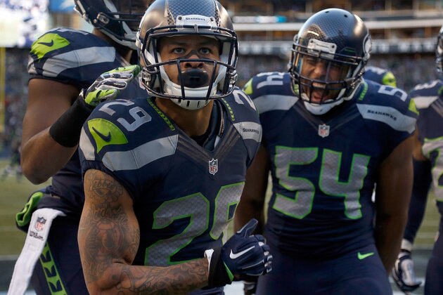 SEATTLE, WA - DECEMBER 14: Free safety Earl Thomas #29 of the Seattle Seahawks celebrates with middle linebacker Bobby Wagner #54 of the Seattle Seahawks after Thomas made a play on a kick return during the htird quarter of the game against the San Francisco 49ers at CenturyLink Field on December 14, 2014 in Seattle, Washington.  (Photo by Otto Greule Jr/Getty Images)