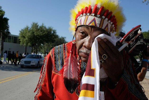 MIAMI - DECEMBER 03:  Washington Redskins 'unofficial' mascot Zema Williams known as Chief Zee wipes his face as he arrives for the funeral of Redskins football player, Sean Taylor, at the Pharmed Arena at Florida International University December 3, 2007 in Miami, Florida. Taylor died November 27, one day after being shot at his home in Miami.  (Photo by Joe Raedle/Getty Images)