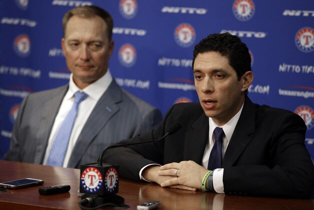 Texas Rangers President of Baseball Operations and General Manager Jon Daniels, right, responds to a questions during a news conference where newly hired Texas Rangers manager Jeff Banister was introduced, Friday, Oct. 17, 2014, in Arlington, Texas. (AP Photo/Tony Gutierrez)