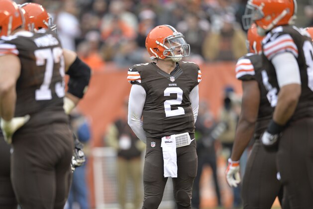 Cleveland Browns quarterback Johnny Manziel (2) stands in the huddle during a timeout in the first quarter of an NFL football game against the Cincinnati Bengals Sunday, Dec. 14, 2014, in Cleveland. Cincinnati won 30-0. (AP Photo/David Richard)