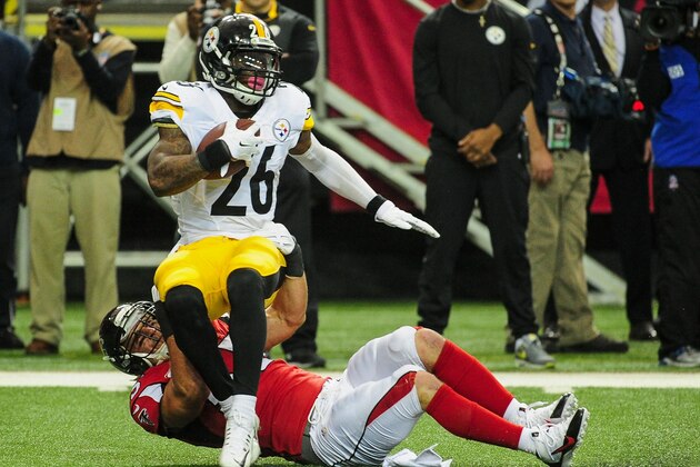 ATLANTA, GA - DECEMBER 14:  Le'Veon Bell #26 of the Pittsburgh Steelers is tackled by Paul Worrilow #55 of the Atlanta Falcons in the first half at the Georgia Dome on December 14, 2014 in Atlanta, Georgia.  (Photo by Scott Cunningham/Getty Images)