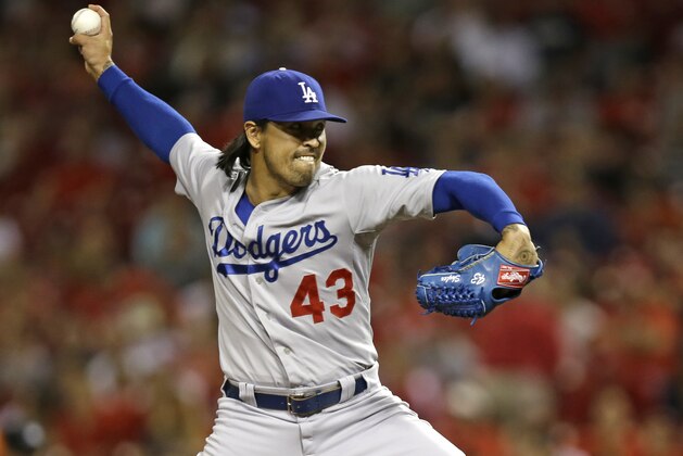 Los Angeles Dodgers relief pitcher Brandon League throws against the Cincinnati Reds in a baseball game, Monday, June 9, 2014, in Cincinnati. (AP Photo/Al Behrman)