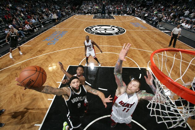 BROOKLYN, NY - DECEMBER 16:  Deron Williams #8 of the Brooklyn Nets shoots the ball against the Miami Heat during the game on December 16, 2014 at Barclays Center in Brooklyn, New York. NOTE TO USER: User expressly acknowledges and agrees that, by downloading and or using this Photograph, user is consenting to the terms and conditions of the Getty Images License Agreement. Mandatory Copyright Notice: Copyright 2014 NBAE (Photo by Reid Kelley/NBAE via Getty Images)