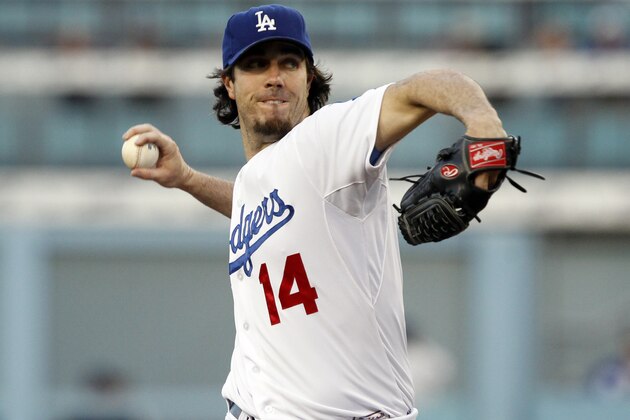 Los Angeles Dodgers starting pitcher Dan Haren throws to the plate in the first inning against the Colorado Rockies in a baseball game Saturday, Sept. 27, 2014, in Los Angeles. (AP Photo/Alex Gallardo)