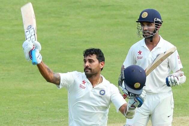 BRISBANE, AUSTRALIA - DECEMBER 17:  Murali Vijay of India celebrates his century with team mate Ajinkya Rahan during day one of the 2nd Test match between Australia and India at The Gabba on December 17, 2014 in Brisbane, Australia.  (Photo by Chris Hyde/Getty Images)