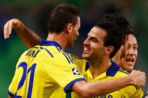 LISBON, PORTUGAL - SEPTEMBER 30:  Nemanja Matic of Chelsea (21) celebrates with team mate Cesc Fabregas as he scores their first goal  during the UEFA Champions League Group G match between Sporting Clube de Portugal and Chelsea FC at Estadio Jose Alvalade on September 30, 2014 in Lisbon, Portugal.  (Photo by Julian Finney/Getty Images)
