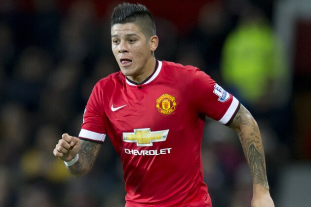 Manchester United's Marcos Rojo during the English Premier League soccer match between Manchester United and Stoke City at Old Trafford Stadium, Manchester, England, Tuesday Dec. 2, 2014. (AP Photo/Jon Super)