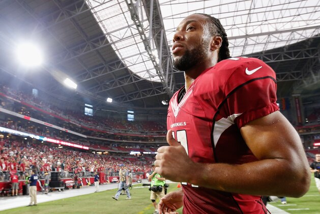 GLENDALE, AZ - OCTOBER 26:  Wide receiver Larry Fitzgerald #11 of the Arizona Cardinals runs off the field following the NFL game against the Philadelphia Eagles at the University of Phoenix Stadium on October 26, 2014 in Glendale, Arizona. The Cardinals defeated the Eagles 24-20.  (Photo by Christian Petersen/Getty Images)