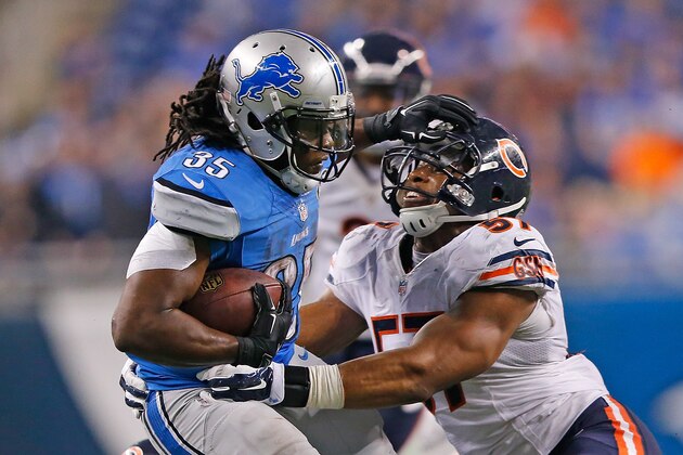 DETROIT, MI - NOVEMBER 27: Joique Bell #35 of the Detroit Lions runs for a short gain as Jon Bostic #57 of the Chicago Bears attempts to make the stop during the third quarter of the game at Ford Field on November 27 , 2014 in Detroit, Michigan. The Lions defeated the Bears 34-17. (Photo by Leon Halip/Getty Images)