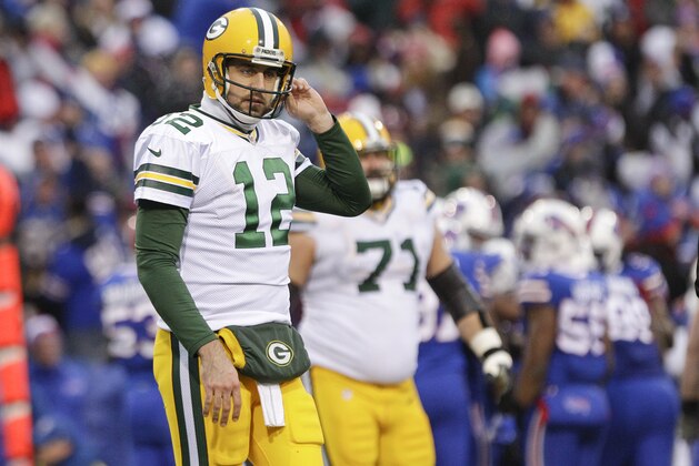 Green Bay Packers quarterback Aaron Rodgers (12) reacts after throwing an interception during the second half of an NFL football game against the Buffalo Bills Sunday, Dec. 14, 2014, in Orchard Park, N.Y. (AP Photo/Bill Wippert)