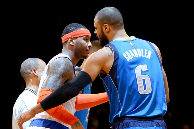 NEW YORK, NY - DECEMBER 04:  Carmelo Anthony #7 of the New York Knicks and Tyson Chandler #6 of the Dallas Mavericks greet each other before the start of the game at Madison Square Garden on December 16, 2014 in New York City.NOTE TO USER: User expressly acknowledges and agrees that, by downloading and/or using this photograph, user is consenting to the terms and conditions of the Getty Images License Agreement.  (Photo by Elsa/Getty Images)