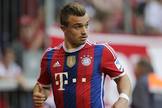 Bayern's Xherdan Shaqiri of Switzerland watches his team mates during the German first division Bundesliga soccer match between FC Bayern and SV Werder Bremen in the Allianz Arena in Munich, Germany, on Saturday, Oct. 18, 2014. (AP Photo/Matthias Schrader)