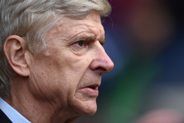 Arsenal’s manager Arsene Wenger looks across the pitch before the English Premier League soccer match between West Bromwich Albion and Arsenal at the Hawthorns,  in Birmingham, England, Saturday, Nov. 29, 2014. (AP Photo/Tim Ireland)