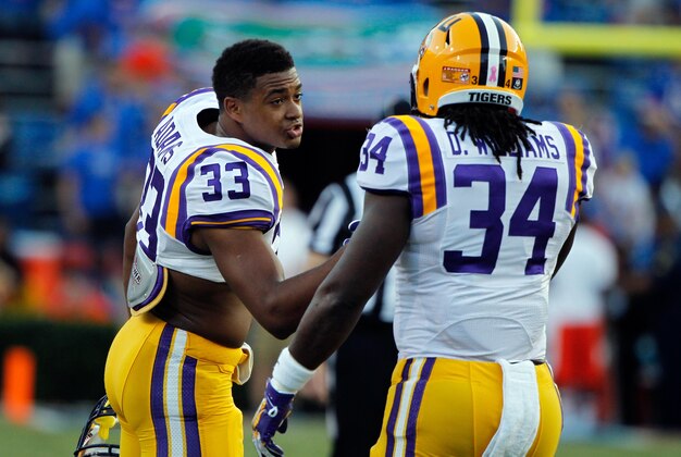 Oct 11, 2014; Gainesville, FL, USA; LSU Tigers safety Jamal Adams (33) talks with running back Darrel Williams (34) prior to the game against the Florida Gators at Ben Hill Griffin Stadium. Mandatory Credit: Kim Klement-USA TODAY Sports