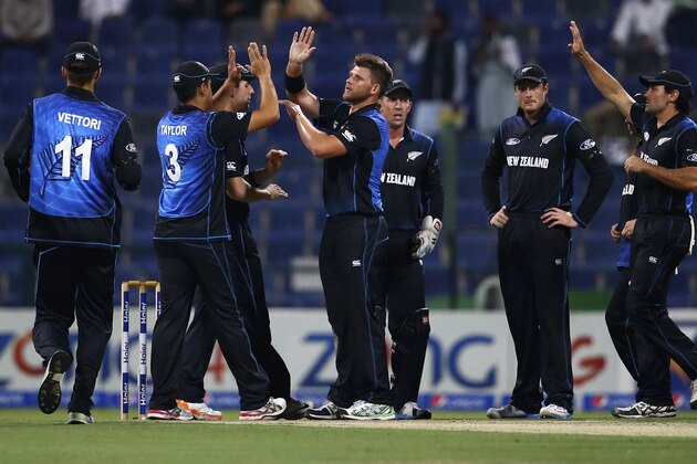 ABU DHABI, UNITED ARAB EMIRATES - DECEMBER 17:  Corey Anderson of New Zealand celebrates with teammates after dismissing  Nasir Jamshed of Pakistan during the 4th One Day International match between Pakistan and New Zealand at Sheikh Zayed Stadium on December 17, 2014 in Abu Dhabi, United Arab Emirates.  (Photo by Francois Nel/Getty Images)