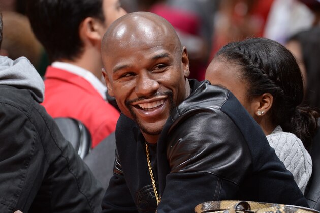 LOS ANGELES, LA -  NOVEMBER 15: Boxer Floyd Mayweather Jr. takes in the game of the Phoenix Suns against the Los Angeles Clippers at STAPLES Center on November 15, 2014 at STAPLES CENTER in Los Angeles, California. NOTE TO USER: User expressly acknowledges and agrees that, by downloading and or using this Photograph, user is consenting to the terms and conditions of the Getty Images License Agreement. Mandatory Copyright Notice: Copyright 2014 NBAE (Photo by Andrew Bernstein/NBAE via Getty Images)