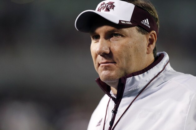 Mississippi State football coach Dan Mullen looks along the sideline during warmups prior to an NCAA college football game against Vanderbilt, Saturday, Nov. 22, 2014, in Starkville, Miss. (AP Photo/Rogelio V. Solis)
