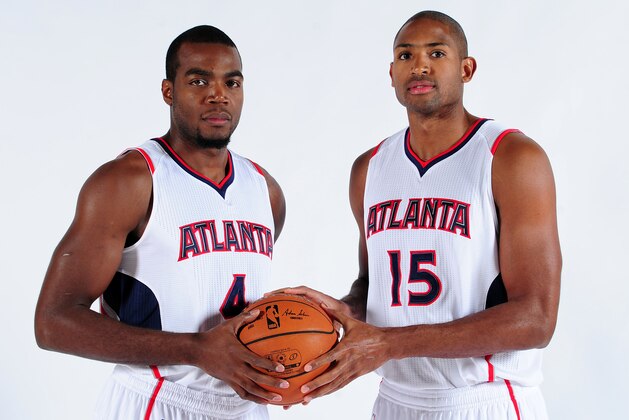 ATLANTA, GA - SEPTEMBER 29: Paul Millsap #4 and Al Horford #15 of the Atlanta Hawks pose for a photograph during the Atlanta Hawks Media Day on September 29, 2014 at Philips Arena in Atlanta, Georgia.  NOTE TO USER: User expressly acknowledges and agrees that, by downloading and/or using this Photograph, user is consenting to the terms and conditions of the Getty Images License Agreement. Mandatory Copyright Notice: Copyright 2014 NBAE (Photo by Scott Cunningham/NBAE via Getty Images)