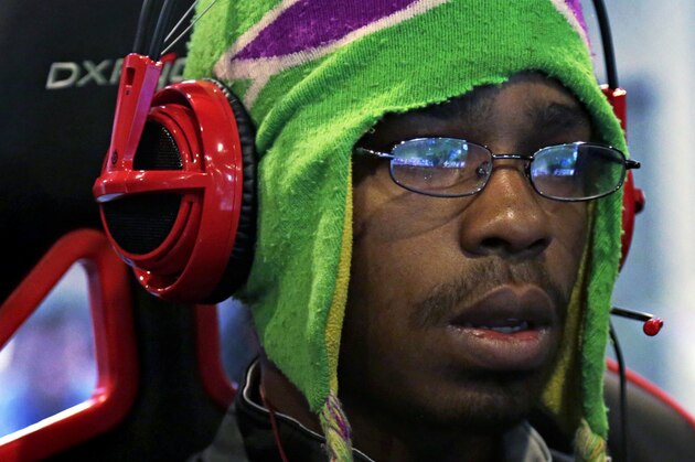 In this Sept. 23, 2014 photo, Robert Morris University Illinois student Dean Mitchell practices playing the video game “League of Legends” with his collegiate teammates at their on-campus training facility in Chicago. The small private university is offering hefty scholarships for players of “League of Legends,” which has become one of the most popular games for organized team competitions nationwide. (AP Photo/M. Spencer Green)