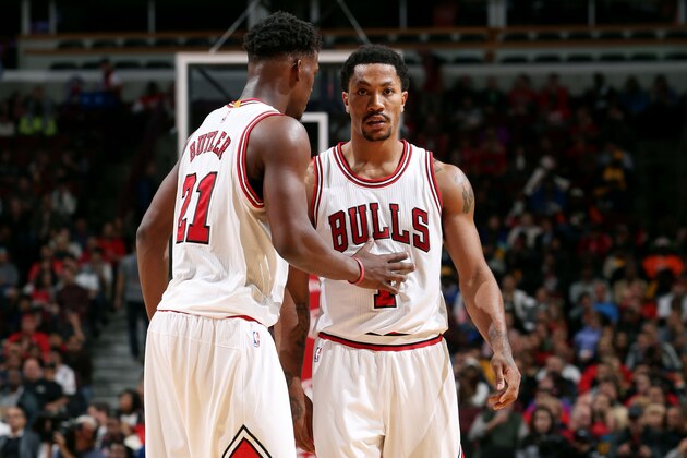 CHICAGO, IL - OCTOBER 13: Jimmy Butler #21 and Derrick Rose #1 of the Chicago Bulls speak during a game against the Denver Nuggets on October 13, 2014 at United Center, Chicago, Illinois. NOTE TO USER: User expressly acknowledges and agrees that, by downloading and or using this Photograph, user is consenting to the terms and conditions of the Getty Images License Agreement. Mandatory Copyright Notice: Copyright 2014 NBAE (Photo by Gary Dineen/NBAE via Getty Images)