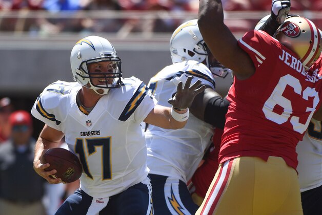 August 24, 2014; Santa Clara, CA, USA; San Diego Chargers quarterback Philip Rivers (17) is pressured by San Francisco 49ers defensive tackle Tony Jerod-Eddie (63) during the first quarter at Levi's Stadium. Mandatory Credit: Kyle Terada-USA TODAY Sports