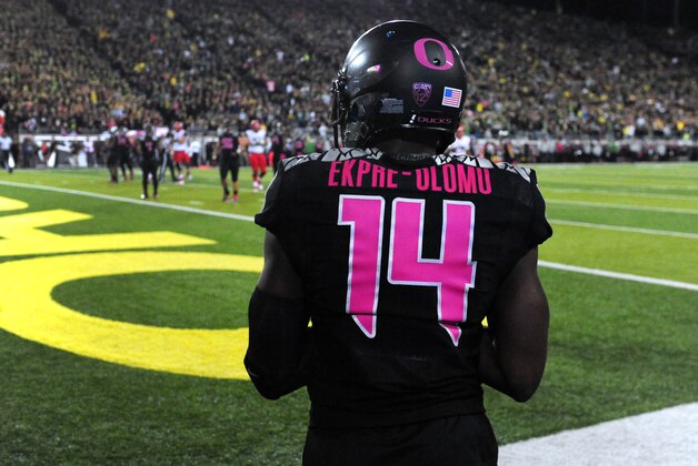 Oregon defensive back Ifo Ekpre-Olomu (14) walks out onto the field during the NCAA college football game against the Arizona at Autzen Stadium on Thursday, Oct. 2, 2014, in Eugene, Ore. Arizona won the game 31-24. (AP Photo/Steve Dykes)
