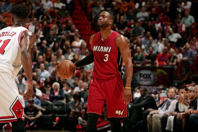 MIAMI, FL - DECEMBER 14: Dwyane Wade #3 of the Miami Heat handles the ball against the Chicago Bulls on December 14, 2014 at American Airlines Arena in Miami, Florida. NOTE TO USER: User expressly acknowledges and agrees that, by downloading and or using this Photograph, user is consenting to the terms and conditions of the Getty Images License Agreement. Mandatory Copyright Notice: Copyright 2014 NBAE (Photo by Isaac Baldizon/NBAE via Getty Images)