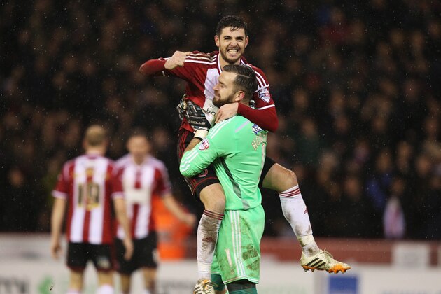 SHEFFIELD, ENGLAND - DECEMBER 16:  Bob Harris of Sheffield United celebrates victory with Mark Howard of Sheffield United after the Capital One Cup Quarter-Final match between Sheffield United and Southampton at Bramall Lane on December 16, 2014 in Sheffield, England.  (Photo by Clive Mason/Getty Images)