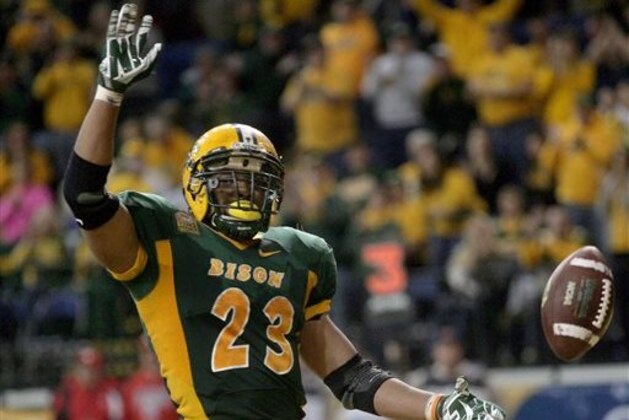 North Dakota State running back John Crockett celebrates after he scored a first-half touchdown against Youngstown State during an NCAA college football game Saturday, Nov. 22, 2014, in Fargo, N.D. (AP Photo/Bruce Crummy)