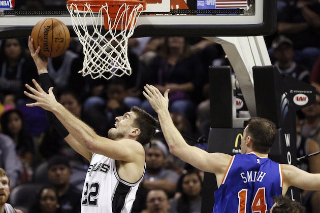 Dec 10, 2014; San Antonio, TX, USA; San Antonio Spurs power forward Tiago Splitter (22) shoots the ball past New York Knicks center Jason Smith (14) during the second half at AT&T Center. Mandatory Credit: Soobum Im-USA TODAY Sports