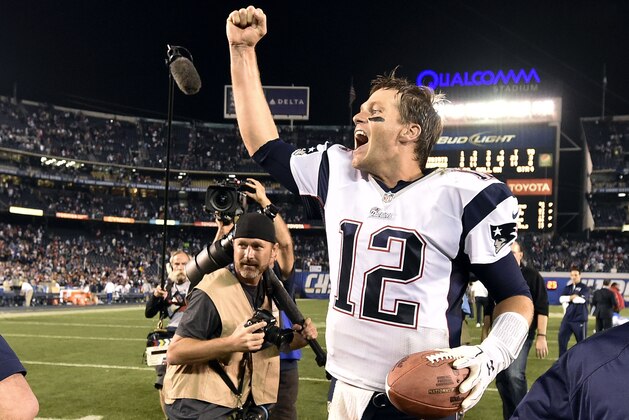 New England Patriots quarterback Tom Brady celebrates after the Patriots defeated the San Diego Chargers 23-14 in an NFL football game Sunday, Dec. 7, 2014, in San Diego.  (AP Photo/Denis Poroy)