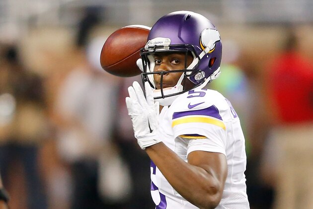 DETROIT, MI - DECEMBER 14: Teddy Bridgewater #5 of the Minnesota Vikings throws a first quarter pass against the Detroit Lions at Ford Field on December 14, 2014 in Detroit, Michigan. (Photo by Leon Halip/Getty Images)