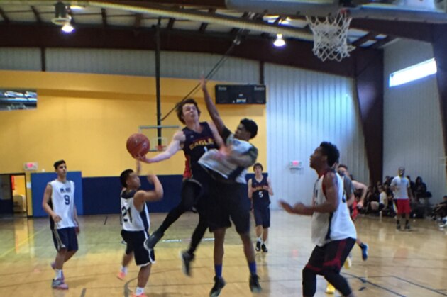 Joe Cook-Green goes to the hoop against Impact Academy.