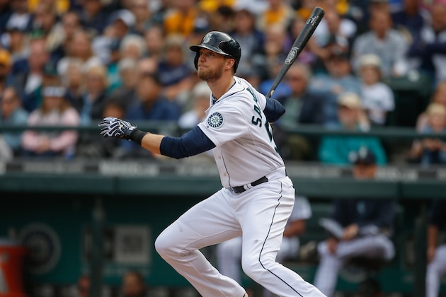 SEATTLE, WA - SEPTEMBER 28:  Michael Saunders #55 of the Seattle Mariners hits an RBI double in the fourth inning against the Los Angeles Angels of Anaheim at Safeco Field on September 28, 2014 in Seattle, Washington.  (Photo by Otto Greule Jr/Getty Images)