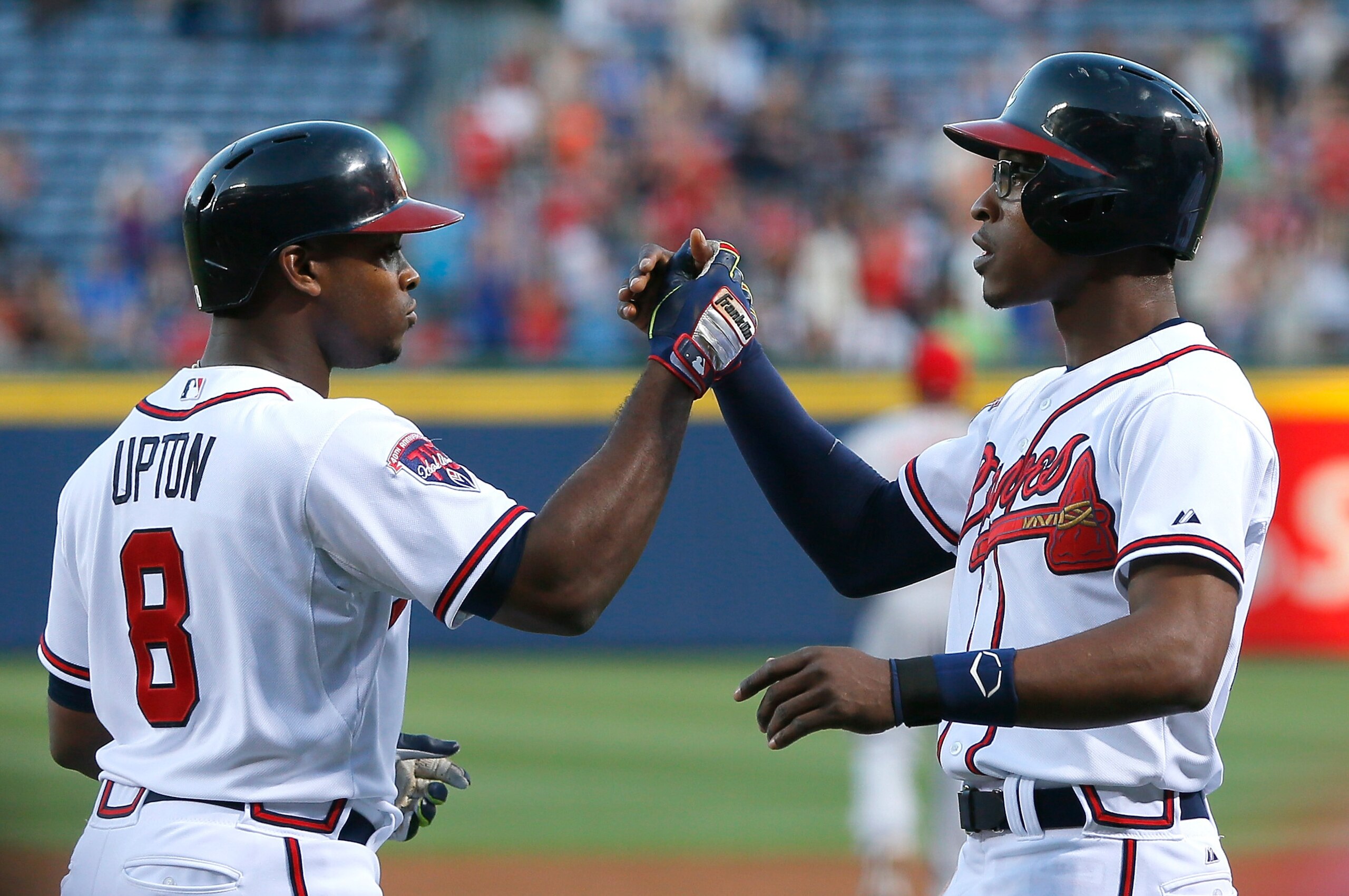 ATLANTA, GA - APRIL 25: Justin Upton #8 of the Atlanta Braves celebrates his three-run homer against the Cincinnati Reds in the first inning with B.J. Upton #2 at Turner Field on April 25, 2014 in Atlanta, Georgia. (Photo by Kevin C. Cox/Getty Images) ATLANTA, GA - APRIL 25: Justin Upton #8 of the Atlanta Braves celebrates his three-run homer against the Cincinnati Reds in the first inning with B.J. Upton #2 at Turner Field on April 25, 2014 in Atlanta, Georgia. (Photo by Kevin C. Cox/Getty Images)