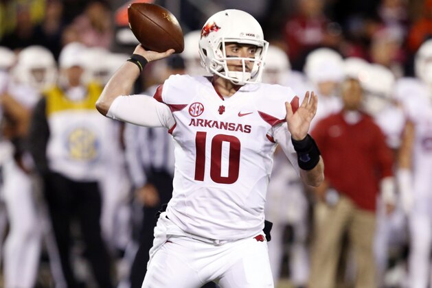 Arkansas quarterback Brandon Allen (10) readies to pass in the first half of an NCAA college football game against Mississippi State in Starkville, Miss., Saturday, Nov. 1, 2014. (AP Photo/Rogelio V. Solis)