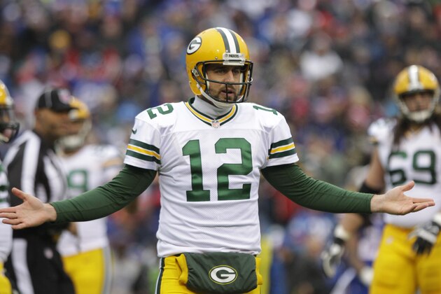 Green Bay Packers quarterback Aaron Rodgers (12) argues an official's call during the first half of an NFL football game against the Buffalo Bills Sunday, Dec. 14, 2014, in Orchard Park, N.Y. (AP Photo/Bill Wippert)