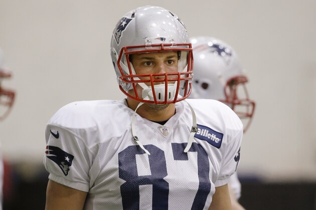 New England Patriots tight end Rob Gronkowski (87) pauses during a stretching session before practice begins at the team's facility Wednesday, Nov. 12, 2014 in Foxborough, Mass. The Patriots will play the Indianapolis Colts Sunday in Indianapolis. (AP Photo/Stephan Savoia)