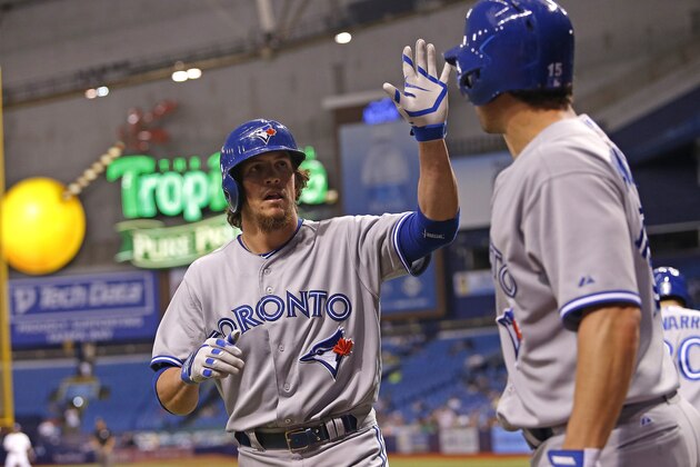 ST. PETERSBURG, FL - SEPTEMBER 4:  Colby Rasmus #28 of the Toronto Blue Jays celebrates his solo home run with Danny Valencia #15 during the 10th inning of a game against the Tampa Bay Rays on September 4, 2014 at Tropicana Field in St. Petersburg, Florida.  (Photo by Brian Blanco/Getty Images)