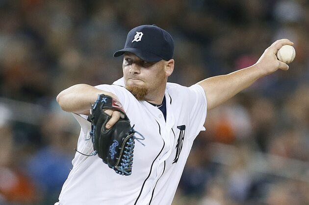 Detroit Tigers pitcher Phil Coke throws against the Minnesota Twins in the eighth inning of a baseball game in Detroit Friday, Sept. 26, 2014. (AP Photo/Paul Sancya)